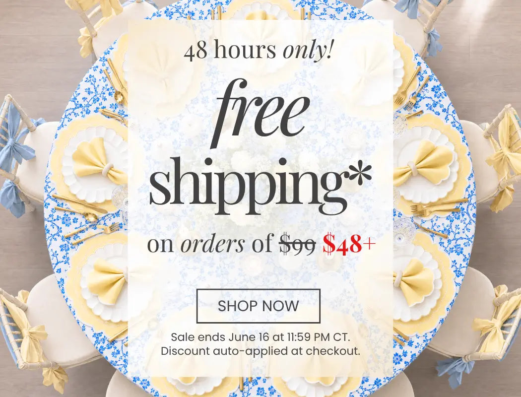 Promotional banner on a round blue-and-white patterned table setting advertising free shipping.