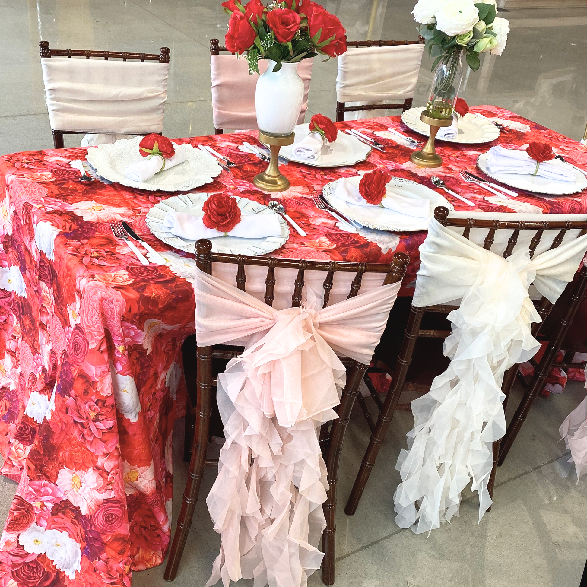 Valentine's Day Mock up with Floral Peony Roses 90"x132" Rectangular Tablecloth Fuchsia, polyester white napkins, floral peony napkin rings, floral centerpieces, and set of soft curly willow ruffles chair sash and cap