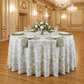 table mockup with the French Toile 132" Round Tablecloth Sage Green, napkins sage green, white roses centerpiece and wine goblets