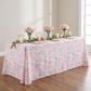 table setting with the French Toile 90"x132" Rectangular Tablecloth Dusty Rose/Mauve, pillar candles and roses floral centerpiece