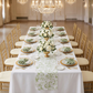 wedding table setting with the French Toile Table Runner Sage Green, gold chiavari chairs, sage green napkins, gold silverware, and gold charger plates
