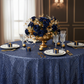 Geometric Glitz Art Deco Sequin Tablecloth 120" Round - Navy Blue close up detail with white charger and dinner plate