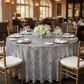 Geometric Glitz Art Deco Sequin Tablecloth 120" Round - Silver for dinner table with silver charger plate | white napkin | wine goblets | gold chiavari chair 