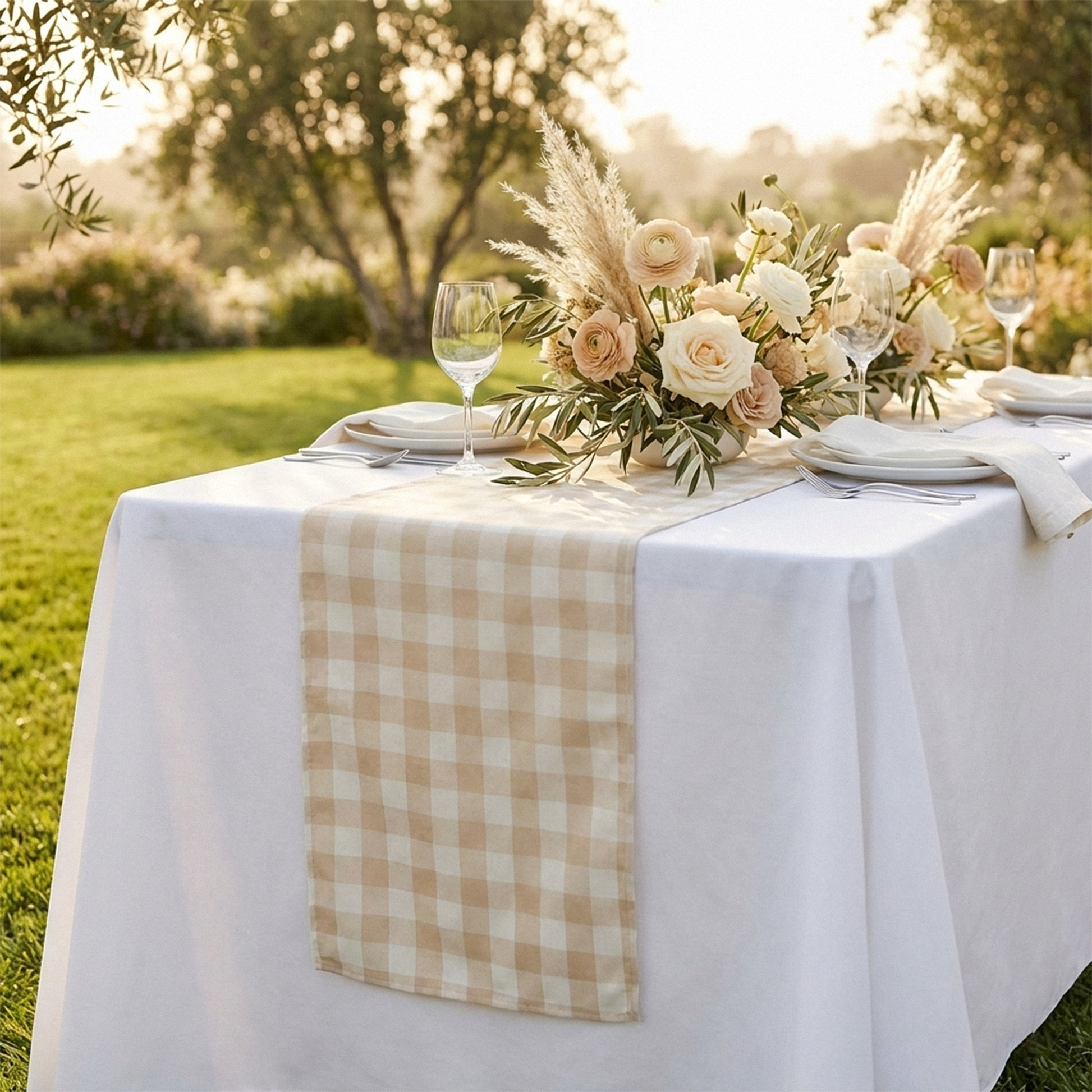 close up of the Gingham Checkered Polyester Table Runner Beige & White outdoor setting  with floral centerpiece and dinnerware