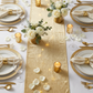 Glitter Velvet Table Runner Champagne close up  with votive candles and gold glass charger plates