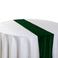 Glitter Velvet Table Runner Emerald Green angled view on a round tablecloth