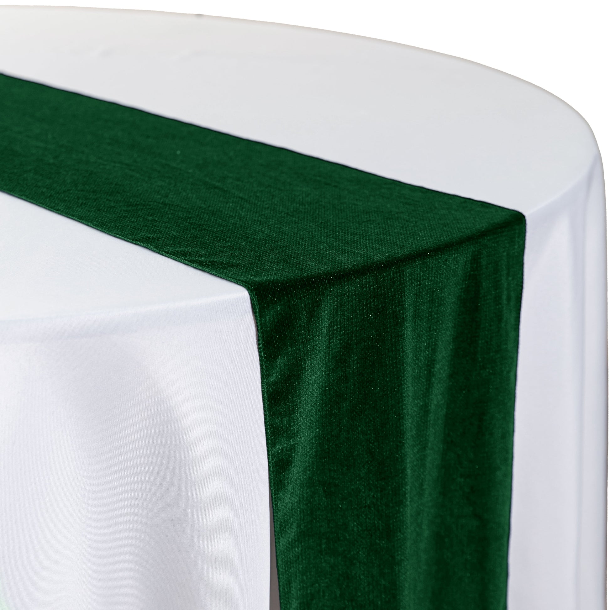 Glitter Velvet Table Runner Emerald Green on a white round tablecloth close up