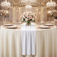 wedding table with the Glitter Velvet Table Runner White on an ivory tablecloth, floral centerpiece and blush/rose gold accents
