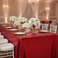 Glitz Sequin 90"x156" Rectangular Tablecloth - Red with gold charger plate | white dinner plate | white chiavari chair | wine goblets