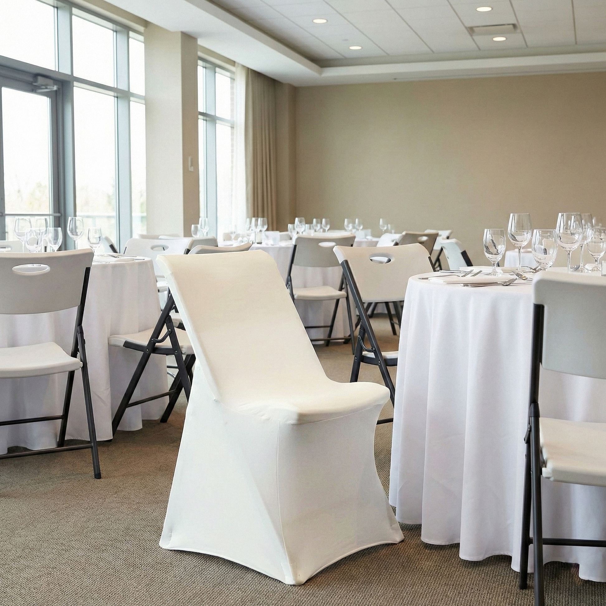 Contemporary LIFETIME Spandex folding chair Cover Ivory showing on the square edge contemporary chair around a round tablecloth