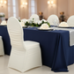 wedding reception showing Ivory Ruched Fashion Spandex Banquet Chair Cover with navy blue tablecloth

