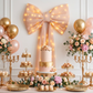 LED Chiffon Bow for Backdrop Blush/Rose Gold close up behind a dessert table