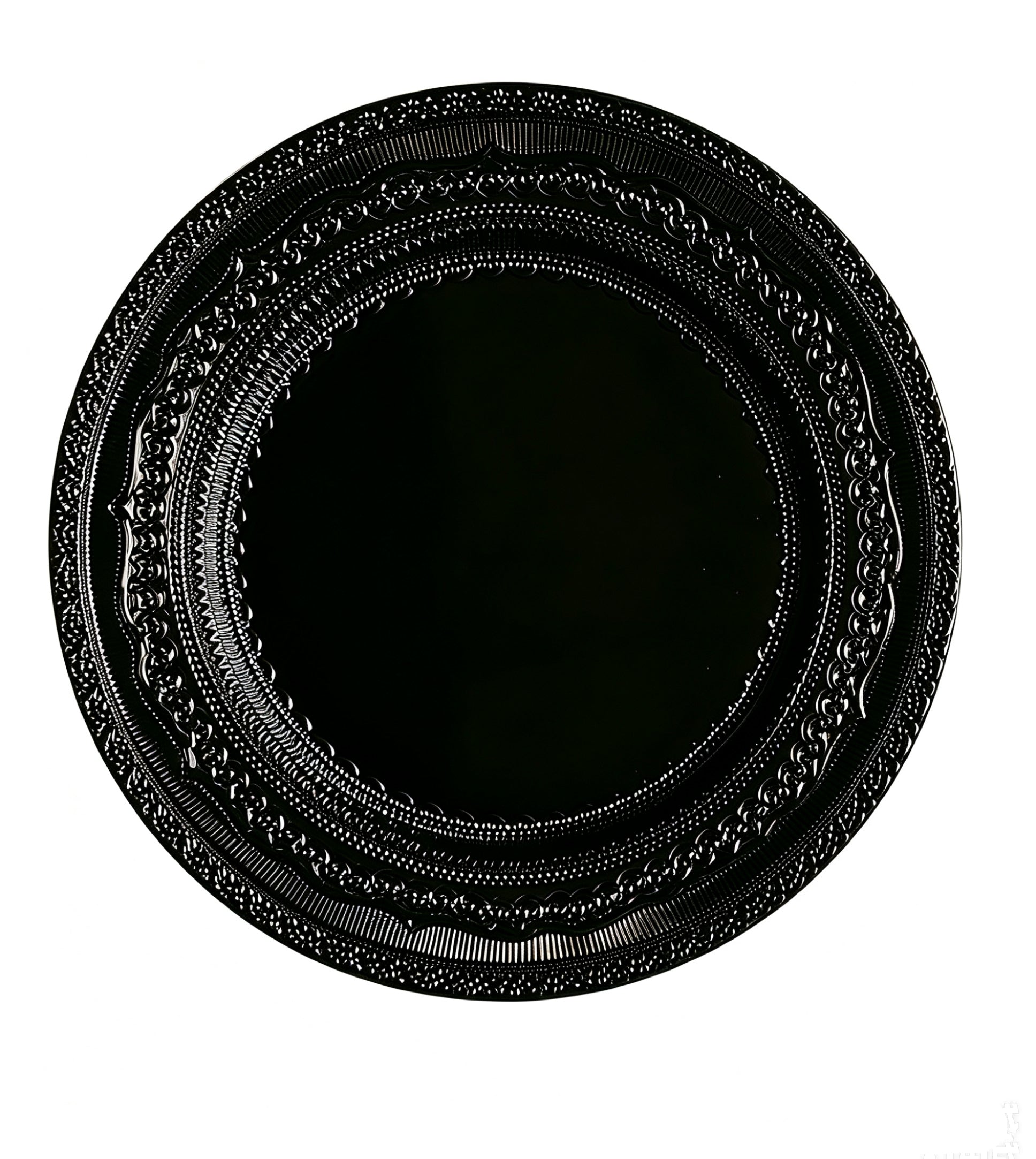 Black lace-embossed acrylic charger plate with ornate edge detailing, ideal for wedding reception tables.