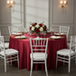 Lamour Satin 132" Round Tablecloth - Apple Red | charger plate | wine goblets | centerpiece |