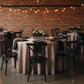 restaurant setup with Lamour Satin 132" Round Tablecloth - Taupe