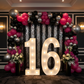 Large 4ft Tall LED Marquee Number - 6 for 16th birthday celebration with silver and black glitz sequin backdrop and black, red, silver balloons