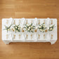 birdseye view of the Luxury Boucle Rectangular Tablecloth White with dinner plates, white napkins and water glasses