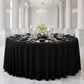 Luxury Boucle Round Tablecloth Black on a round table with wine glasses, silver charger plates and candles