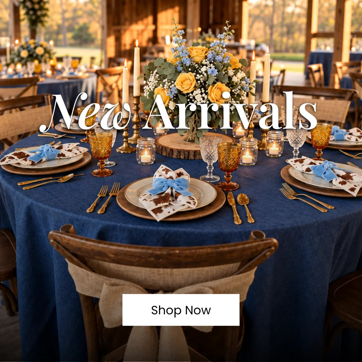 New Arrivals: navy table set with gold cutlery, yellow roses centerpiece and candles for wedding reception tables.
