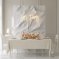 White pleated sculptural birthday panel with neon