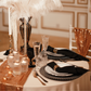 Premium Polyester Napkin Black table setup with glitz mesh runner, black chargers, gold napkins rings