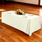 Premium 90"x132" Rectangular Ivory Spun Polyester Tablecloth with white charger plates and floral centerpiece