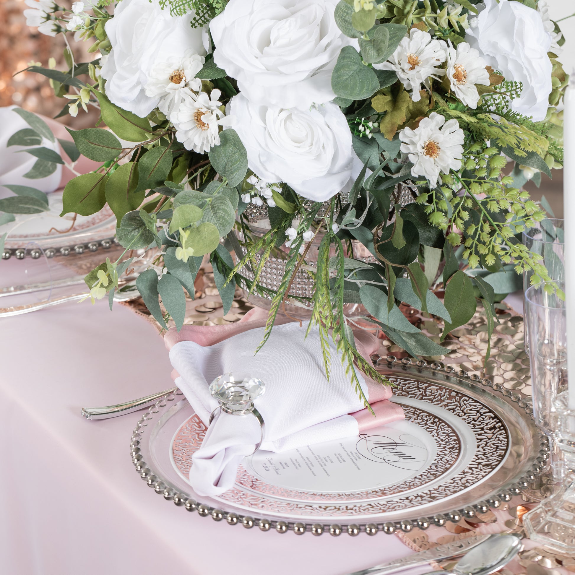 Premium Polyester Napkin White with diamond napkin ring, floral centerpiece and beaded charger plate