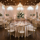 Elegant wedding with the Premium Satin (Wrinkle-Resistant) Round Tablecloth Champagne with chiavari chairs, winge glasses and gold charger plates