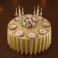 birds eye view of the Premium Satin Wrinkle Resistant Round Tablecloth Gold Antique Wedding Reception Tablescape with gold charger plates, blush napkins and candelabra with tapered candles