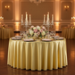 Premium Satin Wrinkle Resistant Round Tablecloth Gold Antique Wedding Reception Tablescape with gold charger plates, blush napkins and candelabra with tapered candles