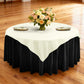 Premium Spun Polyester Square 90x90 Overlay Tablecloth Ivory table setting with floral centerpiece, gold charger plates, ivory napkins ontop a black tablecloth 