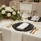 elegant wedding setup using Reef Acrylic Charger Plate - Black on top of ivory tablecloth