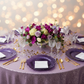 Reef Acrylic Charger Plate - Purple with white napkin | purple glitz tablecloth | wine goblets | flower centerpiece