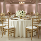 Round 108" Lamour Satin Tablecloth - Ivory with gold charger plate | wine goblets | gold chiavari chair