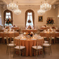 wedding reception with Round Premium Polyester 132" Tablecloth - Burnt Orange
