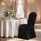 Ruffled Pleated Bottom Spandex Banquet Chair Cover Black with an ivory lamour satin tablecloth, white roses, wine goblets and charger plates