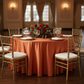 Satin 132" Round Tablecloth - Burnt Orange | charger plate | napkin | wine goblets |