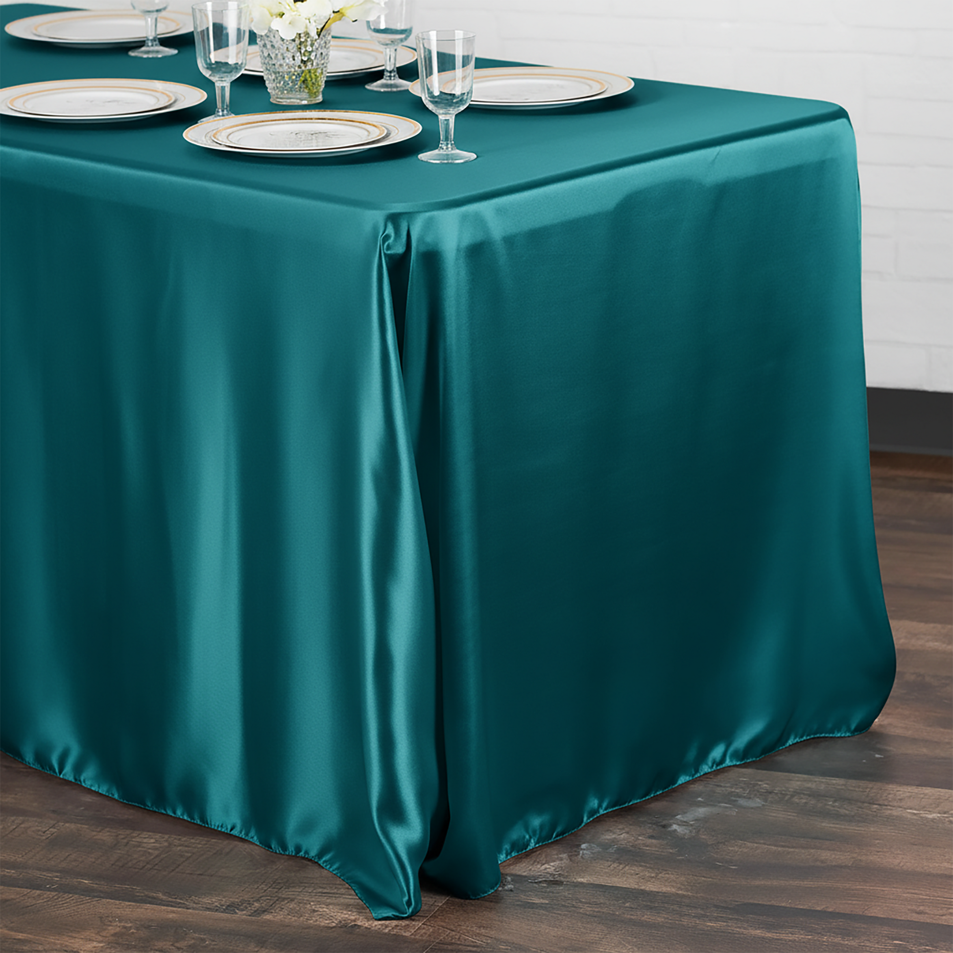 Satin Rectangular Tablecloth 90"x132" Peacock table setting with white chargers, and clear wine goblets
