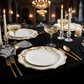 Scalloped Bow Acrylic Charger Plate Gold on top a black tablecloth with striped napkins with a gold napkin ring, gold utensils and champagne glasses