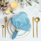 4 pc/pk Scalloped Edge Linen Napkin Baby Blue/White Trim with napkin ring, charger plate, and candles