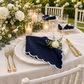 Garden wedding with diagonal triangle-folded navy scalloped napkin