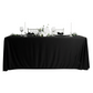 Scuba King 108"x156" Rectangular Tablecloth Black paired with white florals, black polyester napkins, wine goblets, and tapered candles