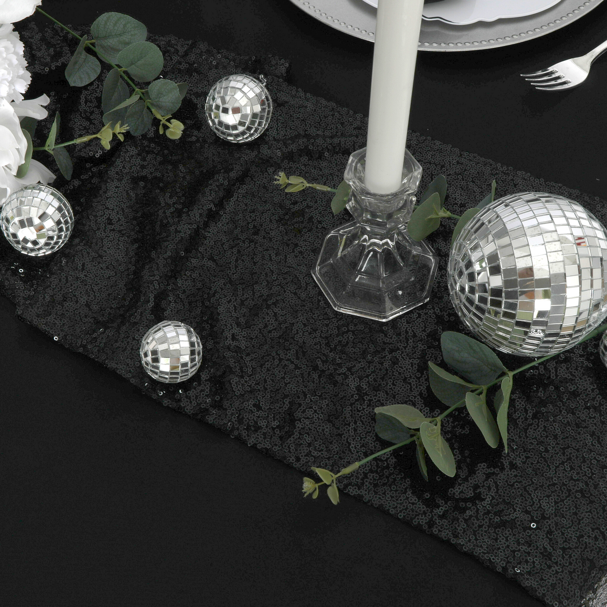 Scuba King 108"x156" Rectangular Tablecloth Black paired with disco balls, glitz black table runner, faux greenery and tapered candles