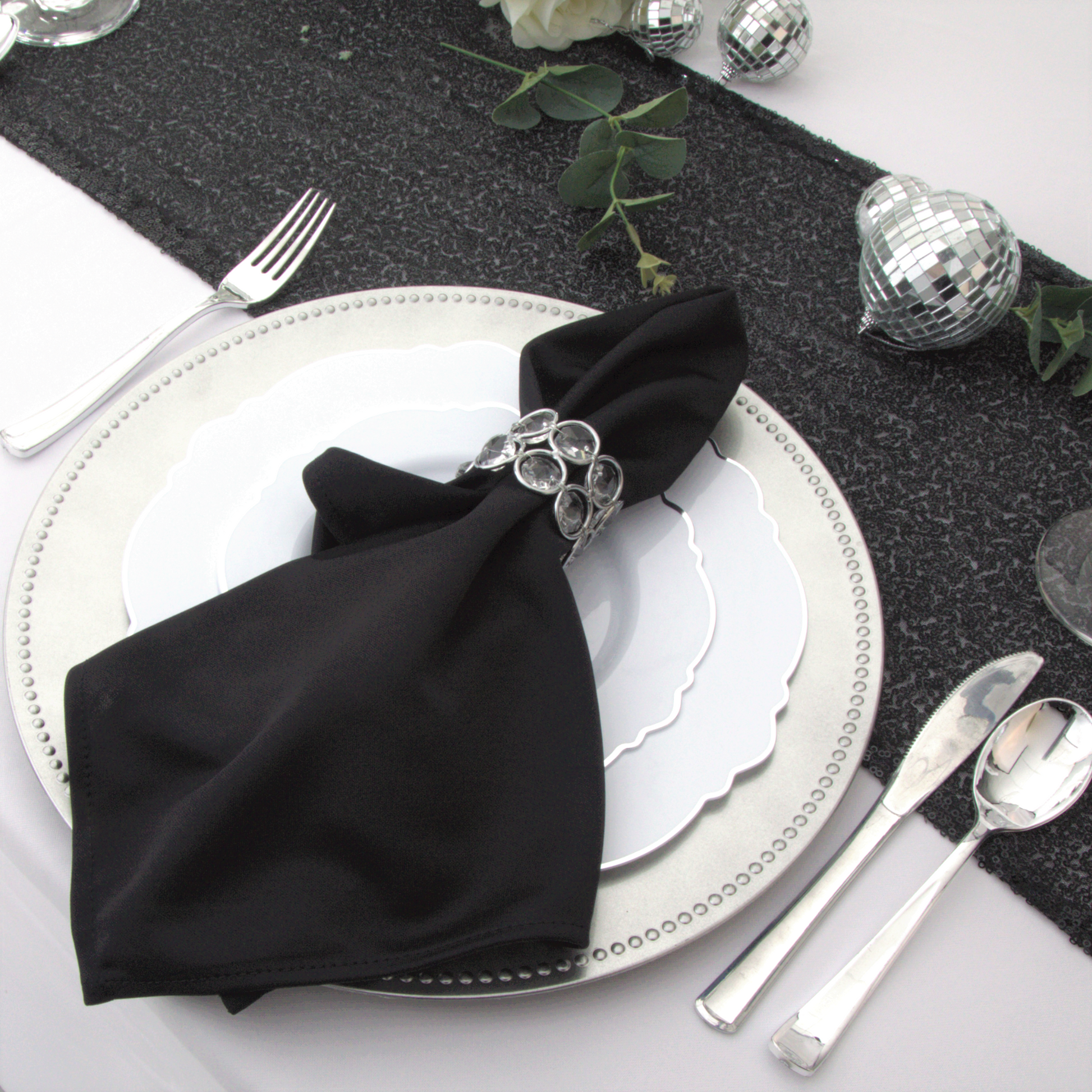 Scuba King 108"x156" Rectangular Tablecloth White paired with silver charger plate, white dinner plates, black polyester napking with crystal napkin 