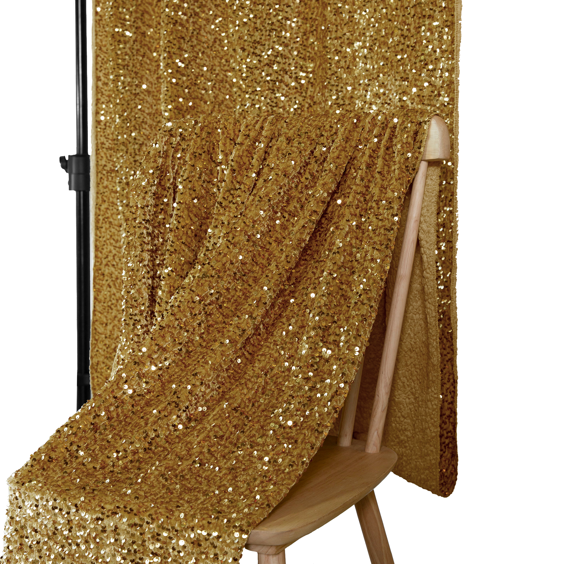 Sequin Velvet Drape Gold draped over a chair