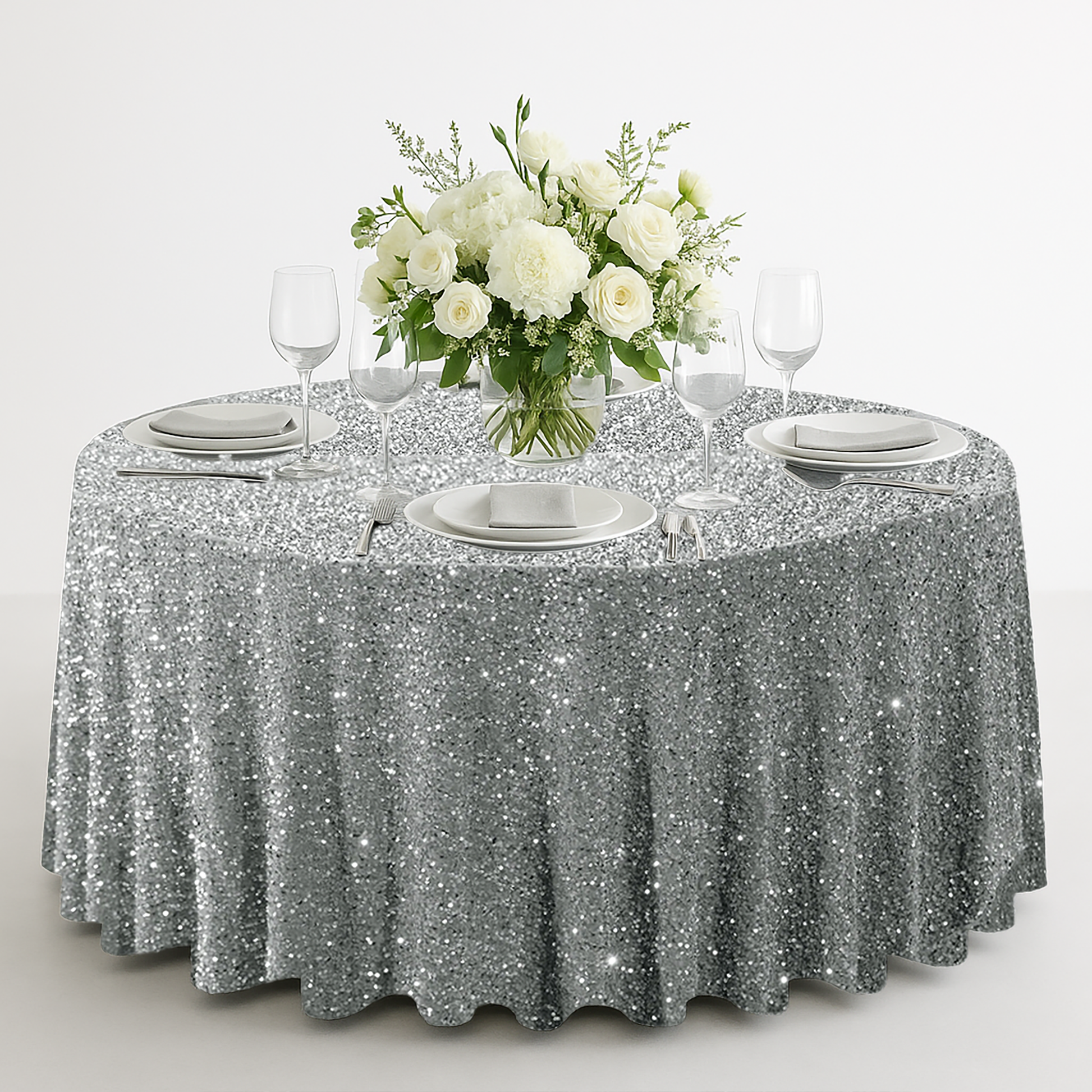 Sequin velvet round tablecloth silver with wine goblets, white charger plates and florals
