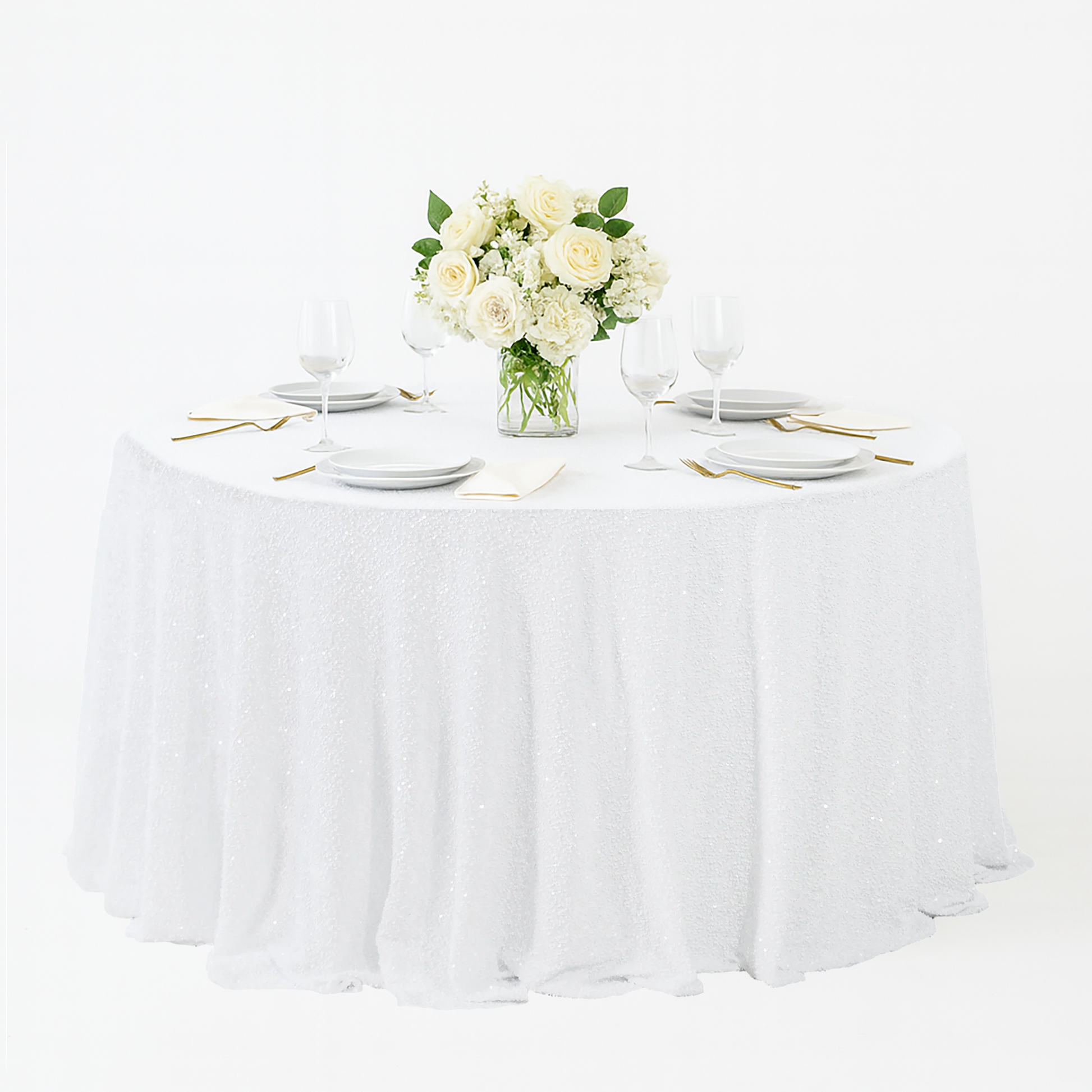 Sequin velvet 132" round tablecloth white with charger plates and florals