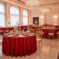 Sequin Velvet Round Tablecloth Red with gold charger plates, water goblets and gold chiavari chairs