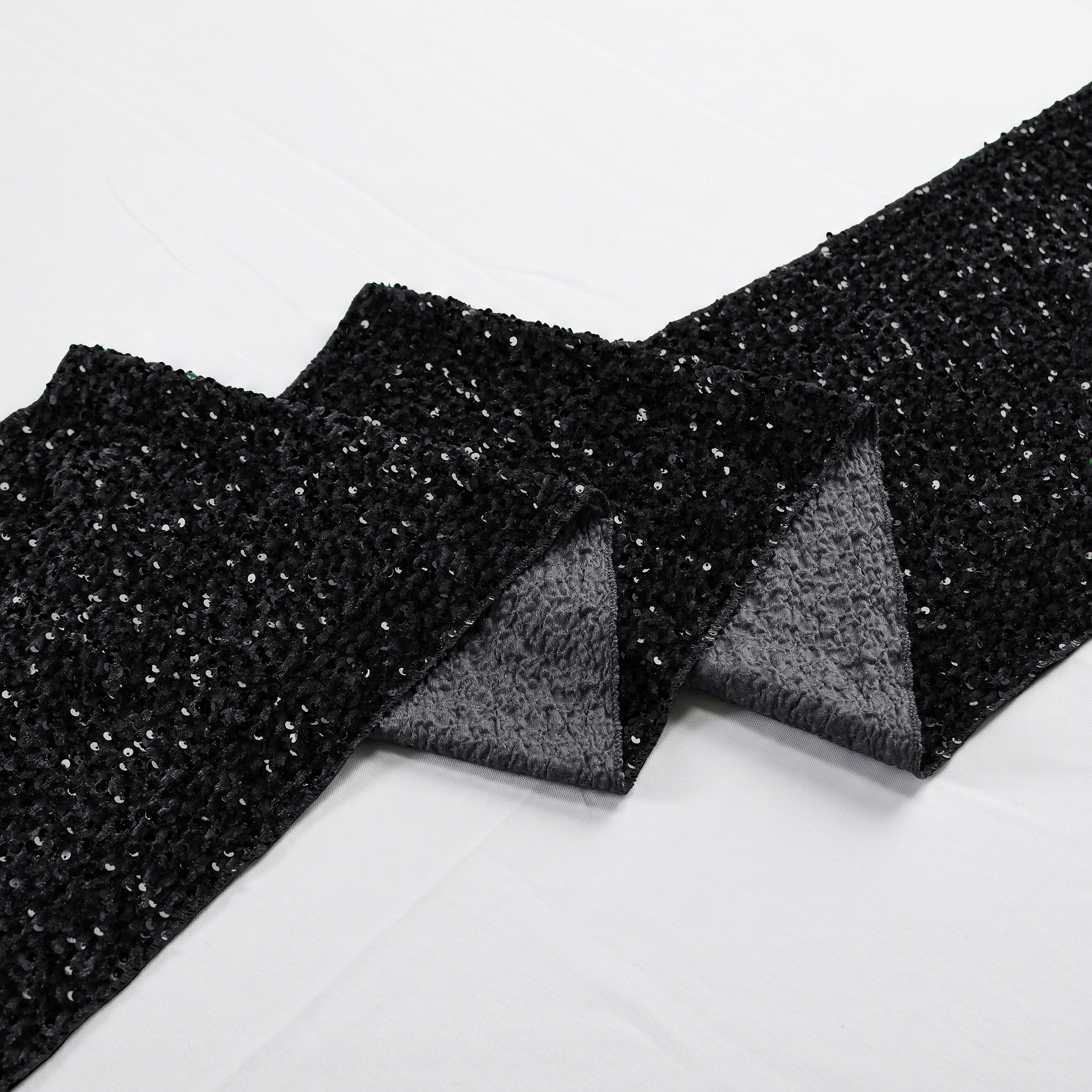 Sequin Velvet Table Runner Black scrunched showing the underside