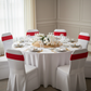 Spandex Chair Band - Red on top of white spandex banquet chair cover for intimate dining table